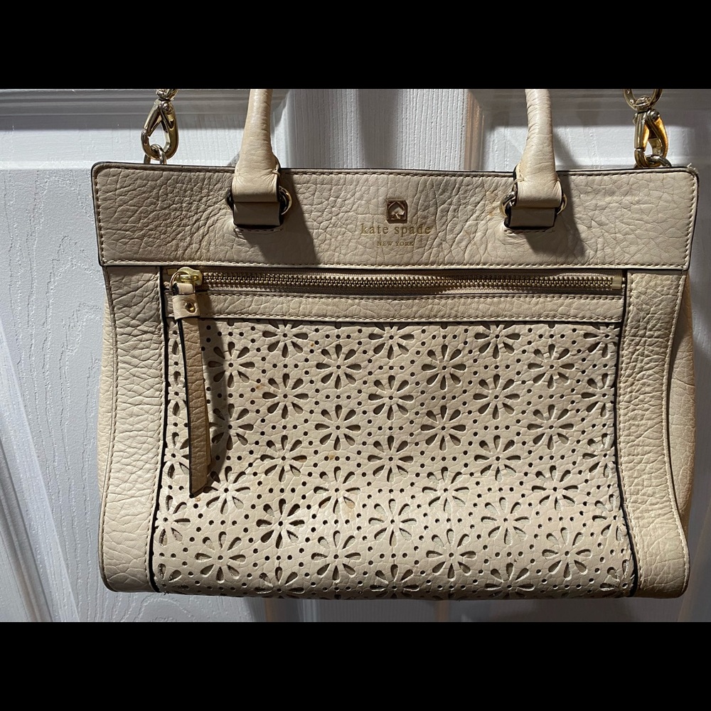 Light tan Kate spade bag I would say more nude color